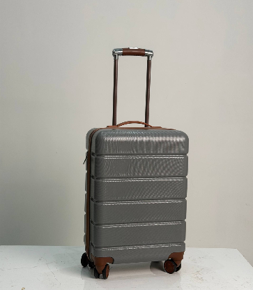 تصویری از چمدان زده دار اقتصادی طرح ساده طوسی سایز کوچک